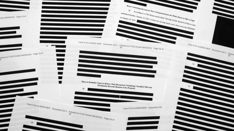 Pages from the affidavit by the FBI in support of obtaining a search warrant for former President Donald Trump’s Mar-a-Lago estate are photographed Friday, Aug. 26, 2022. (AP Photo / Jon Elswick)