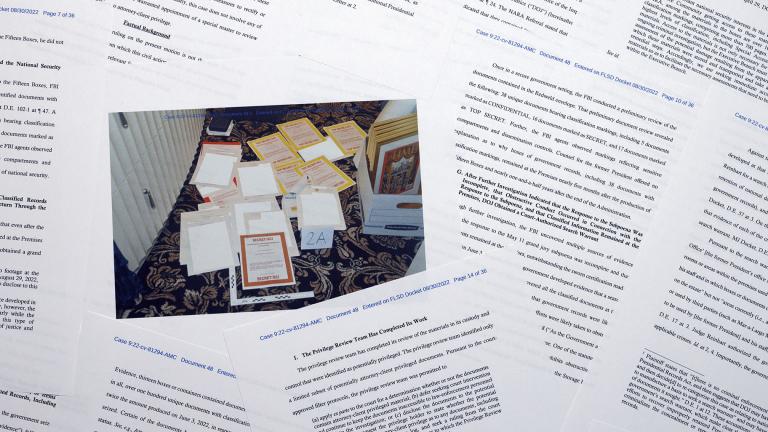 Pages from a Department of Justice court filing on Aug. 30, 2022, in response to a request from the legal team of former President Donald Trump for a special master to review the documents seized during the Aug. 8 search of Mar-a-Lago, are photographed early Aug. 31, 2022. (AP Photo / Jon Elswick, File)