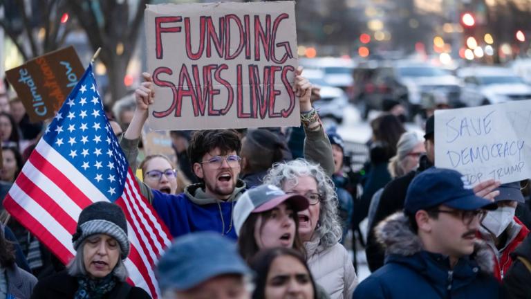 People protest against a funding freeze of federal grants and loans following a push from President Donald Trump to pause federal funding near to the White House in Washington, Tuesday, Jan. 28, 2025. (AP Photo / Ben Curtis)