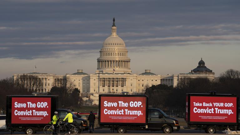 Billboard trucks parked on the National Mall near of the U.S. Capitol during the impeachment trial of former President Donald Trump in Washington, Tuesday, Feb. 9, 2021. (AP Photo / Jose Luis Magana)