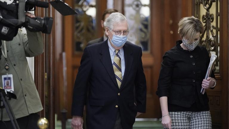 Senate Minority Leader Mitch McConnell of Kentucky, walk in the Capitol as the Senate convenes in a rare weekend session for final arguments in the second impeachment trial of former President Donald Trump, at the Capitol in Washington, Saturday, Feb. 13, 2021. (AP Photo / J. Scott Applewhite)