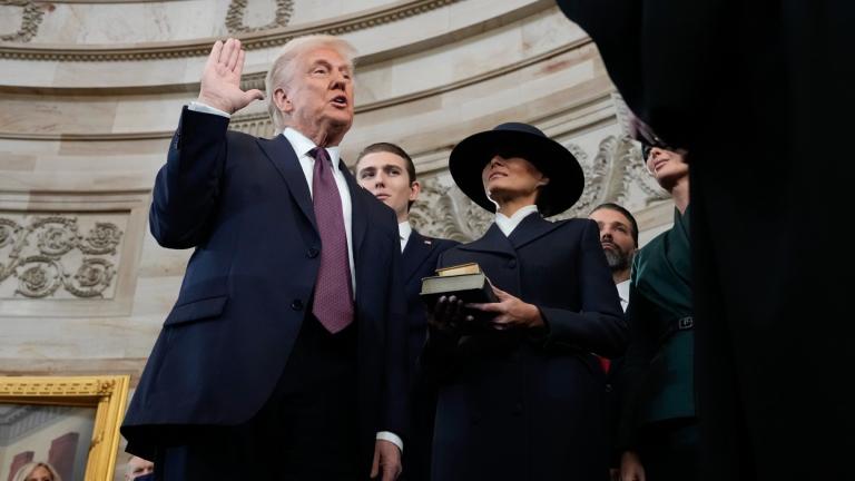 Donald Trump is sworn in as the 47th president of the United States by Chief Justice John Roberts as Melania Trump holds the Bible during the 60th Presidential Inauguration in the Rotunda of the U.S. Capitol in Washington, Monday, Jan. 20, 2025. (AP Photo/Morry Gash, Pool)
