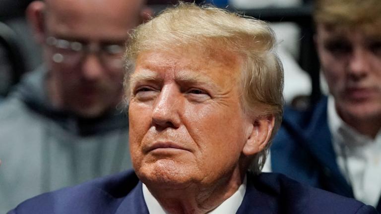 Former President Donald J. Trump watches the NCAA Wrestling Championships, Saturday, March 18, 2023, in Tulsa, Okla. (AP Photo/Sue Ogrocki, File)