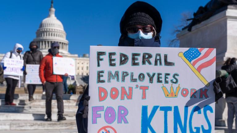 A federal employee, who asked not to use their name for fears over losing their job, protests with a sign saying "Federal Employees Don't Work for Kings" during the "No Kings Day" protest on Presidents Day , Feb. 17, 2025, near the Capitol in Washington. (AP Photo / Jacquelyn Martin, File)