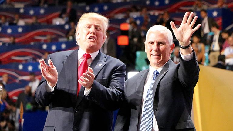 Republican presidential nominee Donald Trump and vice presidential nominee Gov. Mike Pence greet the crowd at the front of the stage. (Evan Garcia / Chicago Tonight) Republican presidential nominee Donald Trump and vice presidential nominee Gov. Mike Pence greet the crowd at the front of the stage. (Evan Garcia / Chicago Tonight)