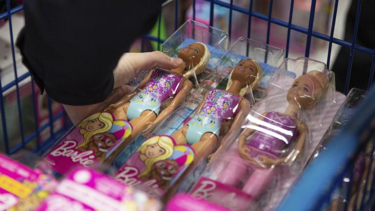 A collection of Barbie dolls are placed into a cart in Bowling Green, Ky., on Tuesday, Dec. 7, 2021. (Grace Ramey/Daily News via AP, File)
