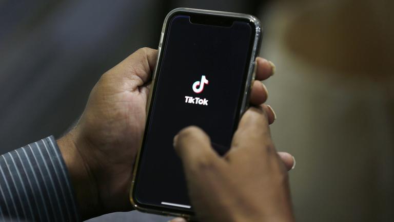 In this July 21, 2020 file photo, a man opens social media app TikTok on his cell phone, in Islamabad, Pakistan. (AP Photo / Anjum Naveed, File)