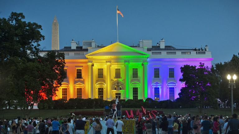 In this Friday, June 26, 2015 file photo, people gather in Lafayette Park to see the White House illuminated with rainbow colors in commemoration of the Supreme Court's ruling to legalize same-sex marriage in Washington. The Trump administration Friday, June 12, 2020, finalized a regulation that overturns Obama-era protections for transgender people against sex discrimination in health care. (AP Photo/Pablo Martinez Monsivais, File) In this Friday, June 26, 2015 file photo, people gather in Lafayette Park to see the White House illuminated with rainbow colors in commemoration of the Supreme Court's ruling to legalize same-sex marriage in Washington. The Trump administration Friday, June 12, 2020, finalized a regulation that overturns Obama-era protections for transgender people against sex discrimination in health care. (AP Photo/Pablo Martinez Monsivais, File)