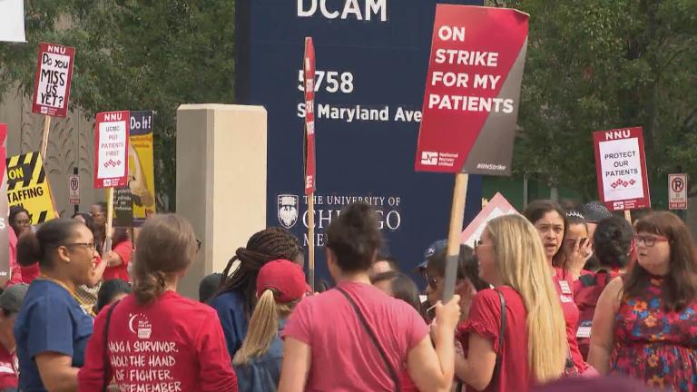Hundreds of people hit the picket line at 7 a.m. Friday to protest what nurses describe as staffing shortages and forced overtime that are risking the safety of patients at the 618-bed hospital. (WTTW News) Hundreds of people hit the picket line at 7 a.m. Friday to protest what nurses describe as staffing shortages and forced overtime that are risking the safety of patients at the 618-bed hospital. (WTTW News)