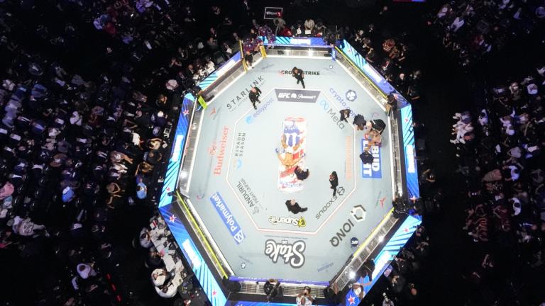 Alex Pereira, far right, is attended to, as Ciryl Gane lays in the center of the ring during UFC Freedom 250 on the South Lawn of the White House, Monday, June 15, 2026, in Washington. (AP Photo / Alex Brandon, Pool)