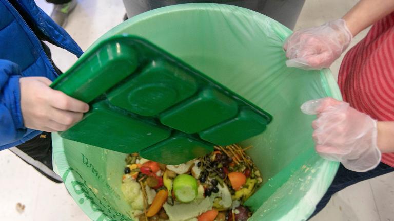 In this Wednesday, Jan. 15, 2020 file photo, students discard food at the end of their lunch period as part of a lunch waste composting program at an elementary school in Connecticut. (Dave Zajac / Record-Journal via AP)