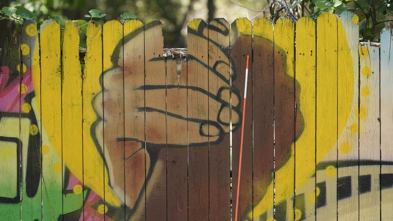 A mural on a fence is displayed at United Fort Worth, a grassroots community organization in Fort Worth, Texas, Tuesday, Aug. 10, 2021. (AP Photo / LM Otero)