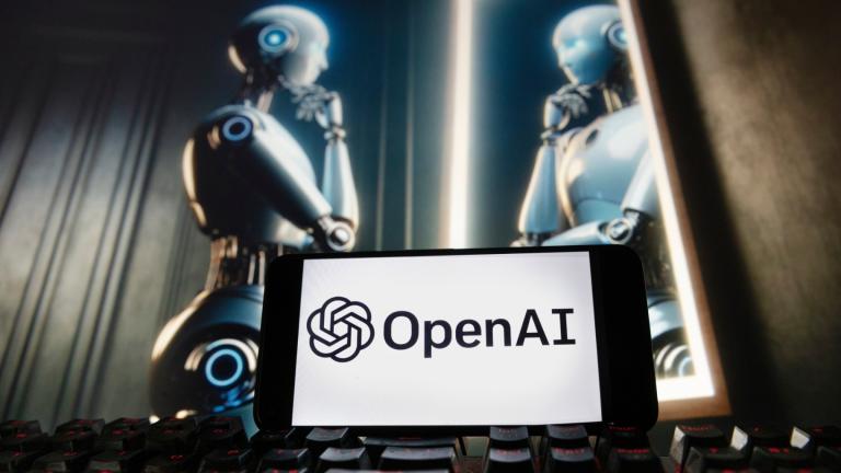 The OpenAI logo is displayed on a cellphone with an image on a computer monitor generated by ChatGPT's Dall-E text-to-image model, Dec. 8, 2023, in Boston. (AP Photo / Michael Dwyer, File)