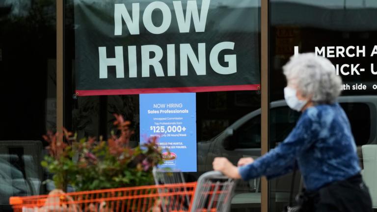 Hiring sign for sales professionals is displayed at a store, in Vernon Hills, Ill., Wednesday, April 15, 2026. (AP Photo / Nam Y. Huh, file)