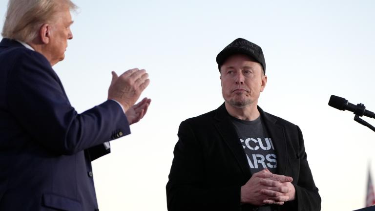 FILE - Republican presidential nominee former President Donald Trump, left, claps as Tesla and SpaceX CEO Elon Musk prepares to depart after speaking at a campaign event at the Butler Farm Show, on Oct. 5, 2024, in Butler, Pa. (Alex Brandon / AP Photo, File)