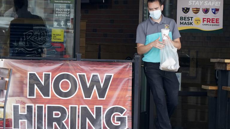 In this Sept. 2, 2020 file photo, a customer wears a face mask as they carry their order past a now hiring sign at an eatery in Richardson, Texas. (AP Photo/LM Otero, File) In this Sept. 2, 2020 file photo, a customer wears a face mask as they carry their order past a now hiring sign at an eatery in Richardson, Texas. (AP Photo/LM Otero, File)