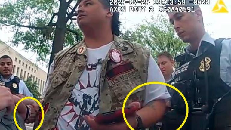 This image from police-worn body camera, and provided and annotated by the Justice Department, in the affidavit to support the criminal complaint and arrest warrant for Zachary Allen Kam, shows Kim during his arrest July 24, 2024, in Washington. (Department of Justice via AP)