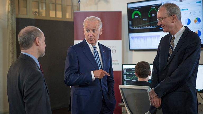 Vice President Joe Biden talks with professor Robert Grossman, director of Center for Data Intensive Science at the University of Chicago, and Louis M. Staudt of the National Cancer Institute as they tour the Genomic Data Commons on June 6. (Robert Kozloff)