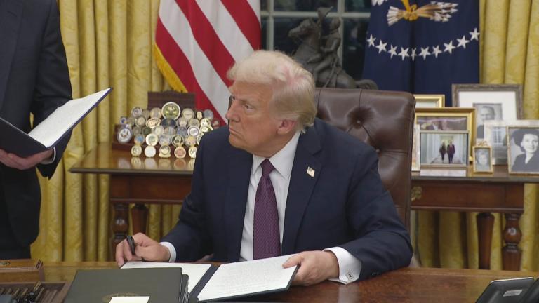 A file photo of President Donald Trump signing an executive order. (WTTW News)