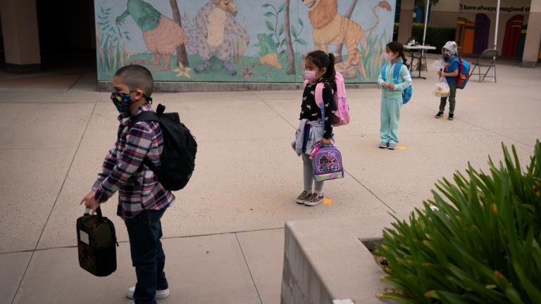 Socially distanced kindergarten students wait for their parents to pick them up on the first day of in-person learning at Maurice Sendak Elementary School on April 13, 2021, in Los Angeles. Vaccination rates for U.S. kindergarteners in 2022 saw a significant drop for the second year in a row, according to new data released Thursday, Jan. 12, 2023, and worried federal officials are launching a new campaign to try to help bring them back up. (AP Photo / Jae C. Hong, File)
