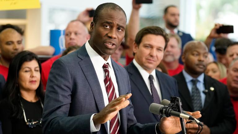 FILE - Florida Surgeon General Dr. Joseph Ladapo gestures as speaks to supporters and members of the media before a bill signing by Gov. Ron DeSantis, Nov. 18, 2021, in Brandon, Fla. (AP Photo / Chris O'Meara, File)