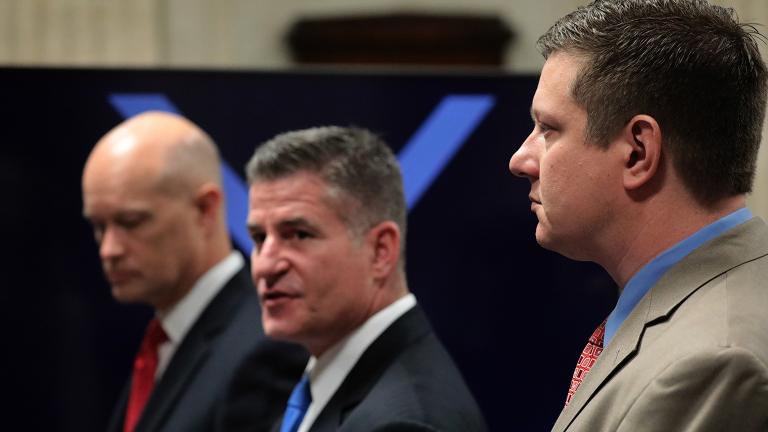 From left: Prosecutor Joseph McMahon, defense attorney Daniel Herbert and Jason Van Dyke approach the judge’s bench on Thursday, Oct. 4, 2018. (Antonio Perez / Chicago Tribune / Pool)