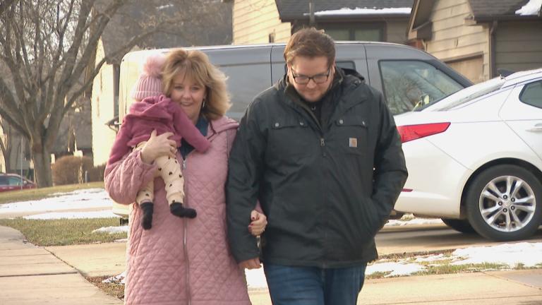 Vicki Strawn walks with her son, Nate Strawn, months after receiving a heart transplant. (WTTW News)