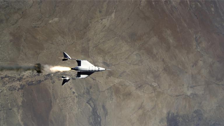 This Saturday, May 22, 2021 image provided by Virgin Galactic shows the release of VSS Unity from VMS Eve and ignition of rocket motor over Spaceport America, N.M. (Virgin Galactic via AP) 