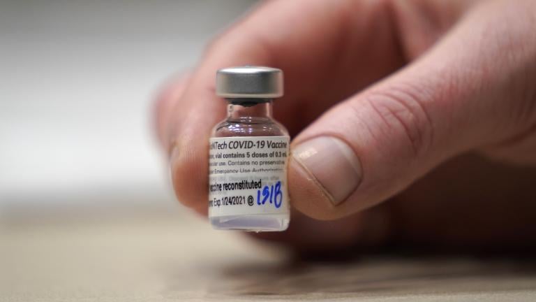 In this Jan. 24, 2021, file photo, a vial of the Pfizer vaccine for COVID-19 is shown at a one-day vaccination clinic set up in an Amazon.com facility in Seattle and operated by Virginia Mason Franciscan Health. (AP Photo/Ted S. Warren, File)