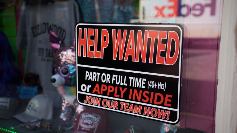 In this May 26, 2021 photo, a sign for workers hangs in the window of a shop along Main Street in Deadwood, S.D. (AP Photo / David Zalubowski)