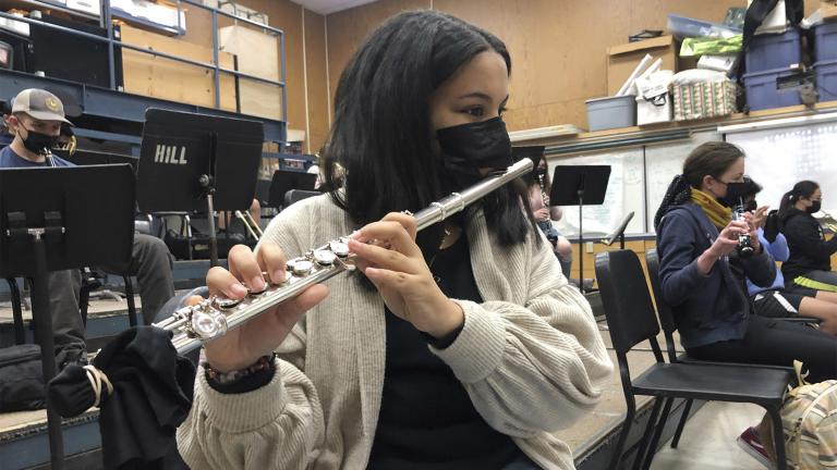FILE - In this March 2, 2021 file photo, a student plays the flute while wearing a protective face mask during a music class at the Sinaloa Middle School in Novato, Calif. (AP Photo / Haven Daily) FILE - In this March 2, 2021 file photo, a student plays the flute while wearing a protective face mask during a music class at the Sinaloa Middle School in Novato, Calif. (AP Photo / Haven Daily)