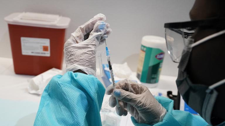 In this July 22, 2021, file photo, health care worker fills a syringe with the Pfizer COVID-19 vaccine at the American Museum of Natural History in New York. (AP Photo / Mary Altaffer, File)