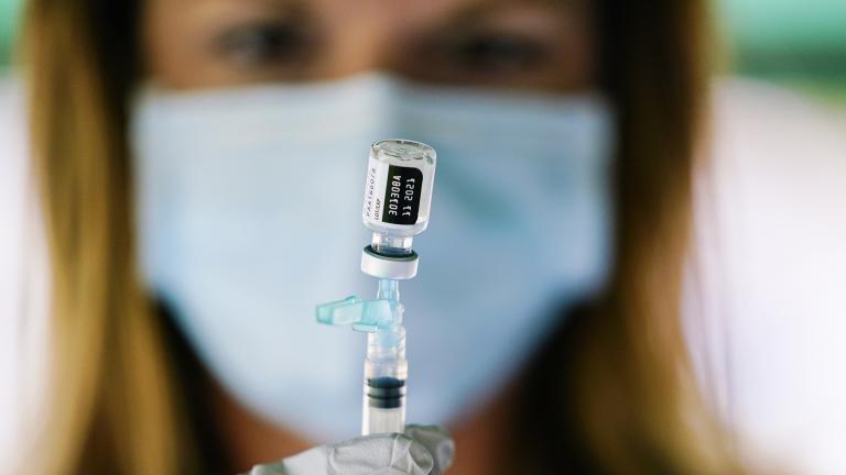 In this Sept. 14, 2021, file photo, a syringe is prepared with the Pfizer COVID-19 vaccine at a clinic at the Reading Area Community College in Reading, Pa. (AP Photo / Matt Rourke, File)