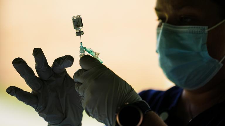 In this Sept. 14, 2021, file photo, a syringe is prepared with the Pfizer COVID-19 vaccine at a clinic at the Reading Area Community College in Reading, Pa. (AP Photo / Matt Rourke)