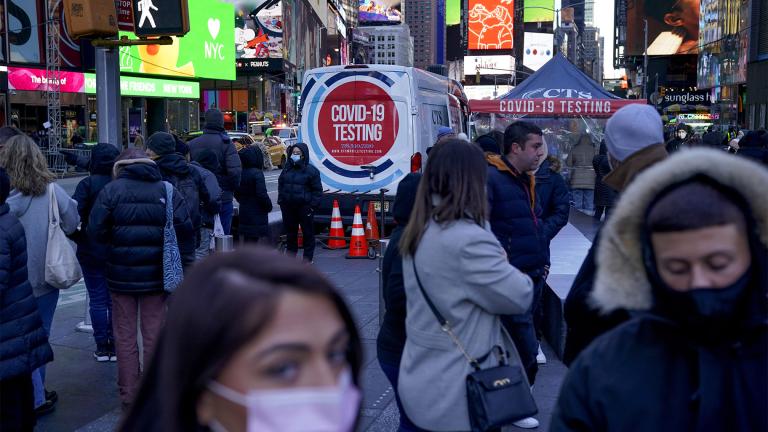 People wait in a long line to get tested for COVID-19 in Times Square, New York, Dec. 20, 2021. (AP Photo / Seth Wenig, file)