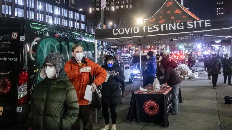 People wait on line to get tested for COVID-19 on Dec. 21, 2021, in New York. (AP Photo / Brittainy Newman, File)