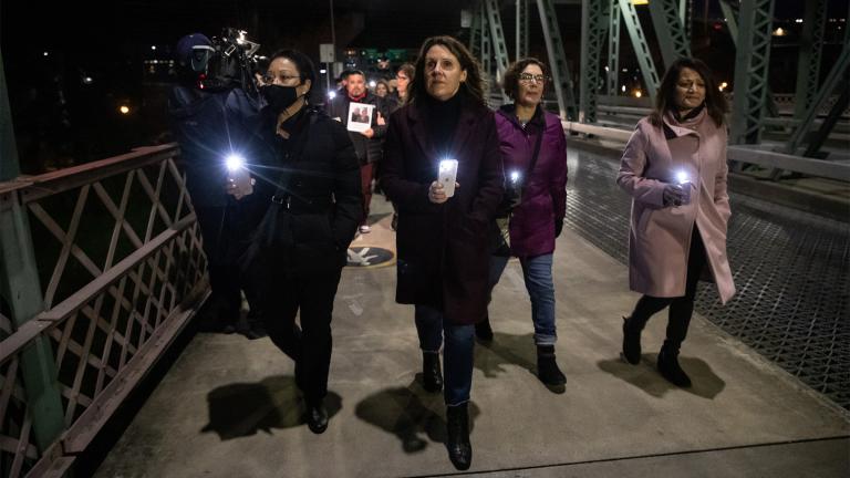 In a photo provided by Multnomah County, Multnomah County Chair Deborah Kafoury, center, leads the illuminated walk over the Hawthorne Bridge with Commissioners Lori Stegmann, left, Jessica Vega Pederson, second from right, and Susheela Jayapal, right, Thursday, March 10, 2022, in Portland, Ore., during an event held two years after the first confirmed case of COVID-19 in Portland. (Motoya Nakamura / Multnomah County via AP)