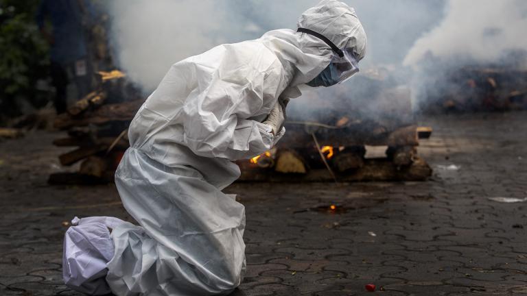 In this July 2, 2021, file photo, a woman breaks down as she prays before the cremation of a relative who died of COVID-19 in Gauhati, India. (AP Photo / Anupam Nath, File) In this July 2, 2021, file photo, a woman breaks down as she prays before the cremation of a relative who died of COVID-19 in Gauhati, India. (AP Photo / Anupam Nath, File)