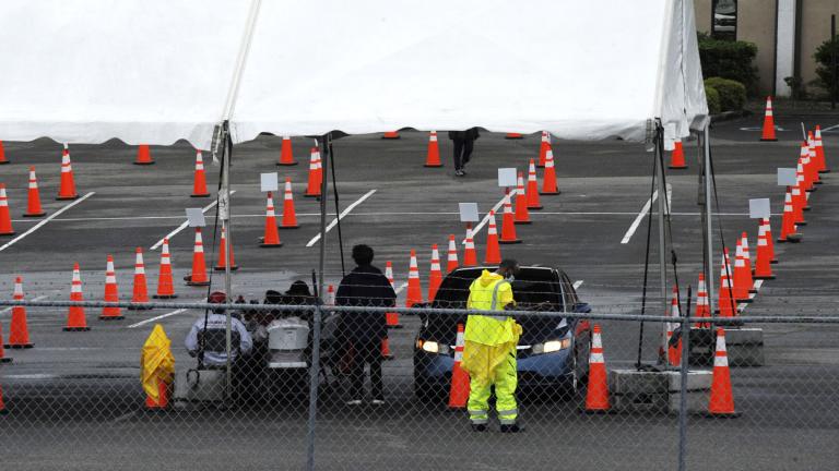 Workers at a mostly empty COVID-19 vaccination clinic located at Cathedral of the Cross A.O.H. Church of God in Birmingham, Ala., are shown on Monday, May 3, 2021. (AP Photo / Jay Reeves)