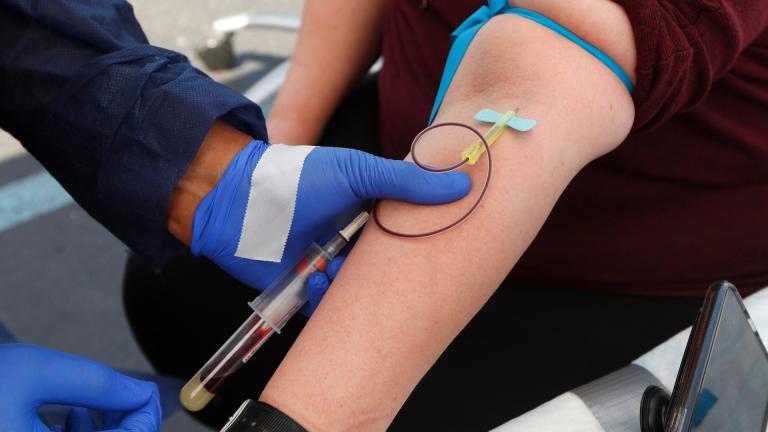 In this Friday, June 12, 2020 file photo, a woman has blood drawn for COVID-19 antibody testing in Dearborn, Mich. (AP Photo / Paul Sancya)
