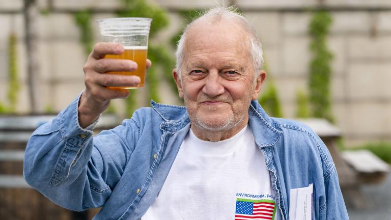 In this May 6, 2021 photo, George Ripley, 72, of Washington, holds up his free beer after receiving the J&J COVID-19 vaccine shot, at The REACH at the Kennedy Center in Washington. (AP Photo / Jacquelyn Martin)