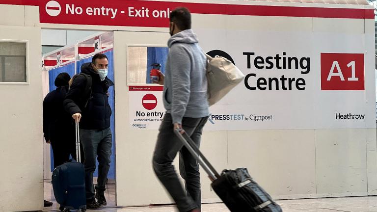 Passengers get a COVID-19 test at Heathrow Airport in London, Nov. 29, 2021. (AP Photo / Frank Augstein, File)