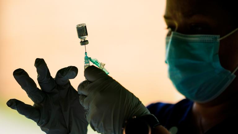 A syringe is prepared with the Pfizer COVID-19 vaccine at a clinic at the Reading Area Community College in Reading, Pa., on Sept. 14, 2021. (AP Photo / Matt Rourke, File)