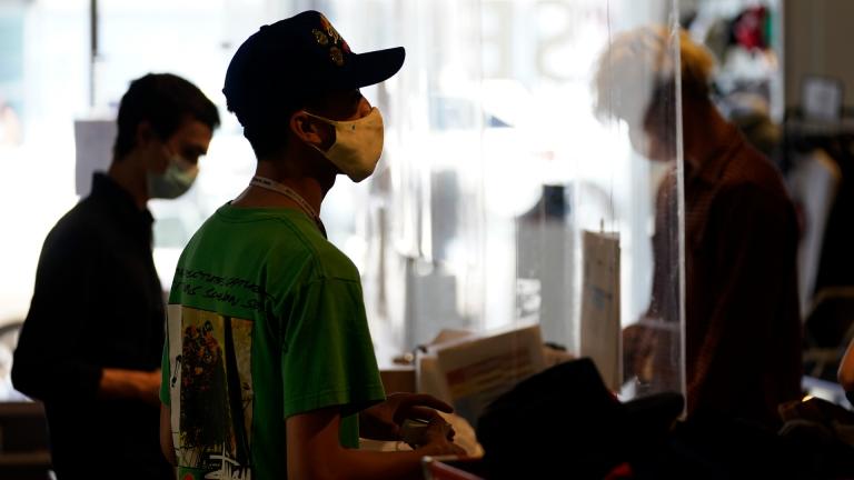 In this July 19 2021 file photo, employees check out customers at 2nd Street second hand store in the Fairfax district of Los Angeles. (AP Photo / Marcio Jose Sanchez, File) In this July 19 2021 file photo, employees check out customers at 2nd Street second hand store in the Fairfax district of Los Angeles. (AP Photo / Marcio Jose Sanchez, File)