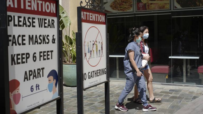 In this June 11, 2021, file photo, customers wear face masks in an outdoor mall with closed business amid the COVID-19 pandemic in Los Angeles. (AP Photo / Damian Dovarganes, File) In this June 11, 2021, file photo, customers wear face masks in an outdoor mall with closed business amid the COVID-19 pandemic in Los Angeles. (AP Photo / Damian Dovarganes, File)