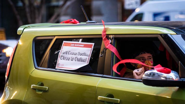 Members of the Chicago Teachers Union and supporters stage a car caravan protest outside City Hall in the Loop, Jan. 5, 2022. (Ashlee Rezin  / Chicago Sun-Times via AP)