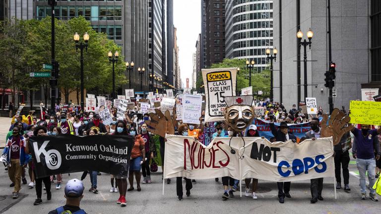 Chicago Teachers Union members and hundreds of supporters march through the Loop, Wednesday, June 24, 2020. (Ashlee Rezin Garcia / Chicago Sun-Times via AP)