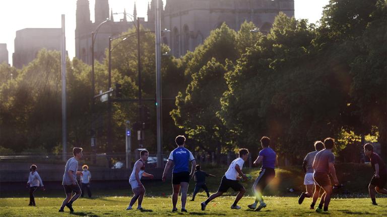 University of Chicago men's rugby team players practice on the Midway Plaisance near the campus in Chicago, May 6, 2021. The University of Chicago is delaying its new term and holding the first two weeks online. (AP Photo / Shafkat Anowar, File)