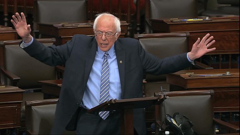 In this image from video, Sen. Bernie Sanders, I-Vt., speaks on the Senate floor at the U.S. Capitol in Washington, Wednesday, March 25, 2020. (Senate Television via AP) In this image from video, Sen. Bernie Sanders, I-Vt., speaks on the Senate floor at the U.S. Capitol in Washington, Wednesday, March 25, 2020. (Senate Television via AP)