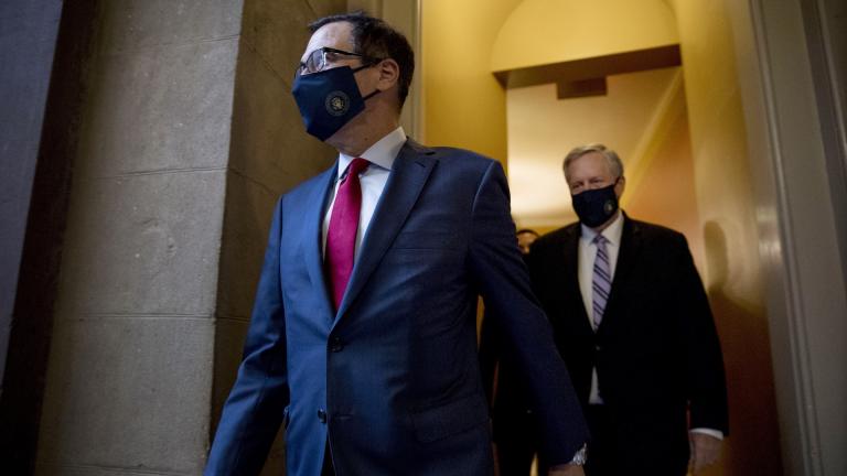 Treasury Secretary Steven Mnuchin, left, and White House Chief of Staff Mark Meadows, right, walk to speak to reporters after meeting with House Speaker Nancy Pelosi of Calif. and Senate Minority Leader Sen. Chuck Schumer of N.Y. as they continue to negotiate a coronavirus relief package on Capitol Hill in Washington, Friday, Aug. 7, 2020. (AP Photo/Andrew Harnik)